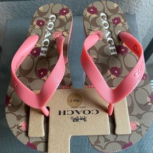 NWT Coach signature flip flops. Floral pattern.